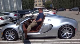 Arnold Schwarzenegger shows off his million dollar car to Sylvester Stallone