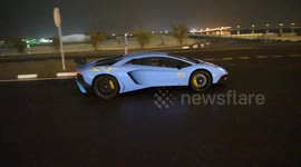 Lamborghini driver does donut in puddle