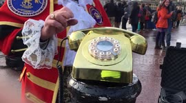 Royalist Crier sings his congratulations  on 'golden phone' to Royal lovebirds