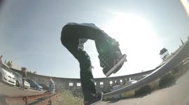 Teen skater takes rail between legs before landing on head