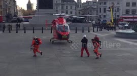 Air Ambulance helicopter lands in London's Trafalgar Square
