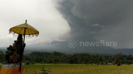 Bali volcano continues to erupt as airport reopens