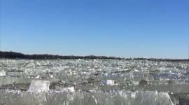Mesmerising footage of ice waves breaking on frozen lake