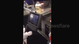 3 Month old baby watching a movie on a plane!