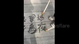 Man shows off amazing calligraphy skills in park