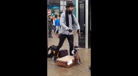 Amazing busker in Manchester, United Kingdom, during busy Christmas shopping day