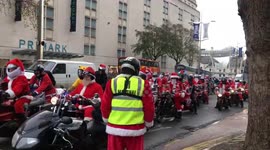 Newsflare Edit - Hundreds of bikers ride through UK city dressed as Santa Claus