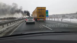 Burning car on motorway