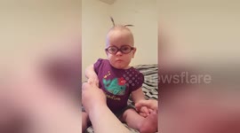 Triplet baby born at 25 weeks sees clearly for first time with glasses
