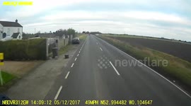 Idiot car driver pulls out on lorry