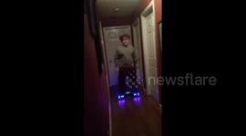 Boy on hoverboard crashes into Christmas tree