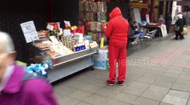 Santa Claus shops early for gifts in Essex market