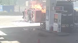 Lorry bursts into flames after crash at petrol station