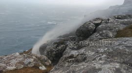 Waterfall flowing backwards landscape orientation isle of Skye Scotland during Storm Caroline