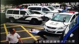 Bizarre moment man pretends to be hit by a police car