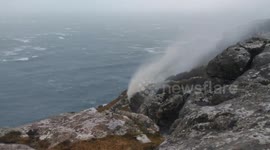Waterfall flows backwards as Storm Caroline hits Scotland