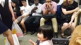 Adorable baby can't stop blowing kisses to strangers on train in Taiwan