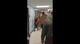 Marine surprises his little sister at School