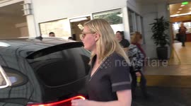 Radiant Kirsten Dunst puts on a leggy display in a chic little black dress in Beverly Hills
