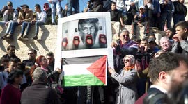 Palestinian protesters chant 'God is great' as Israeli forces arrive on horseback