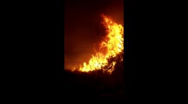 Thomas Fire Ventura Wildfire - Fire Tornado erupts and shoots out approximately 50 yards across Foothill Road and over a house across the street