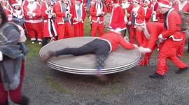 Drunk Santas on kids play area in Tower Hill.