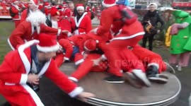 Hundreds of drunk Santas run amok in London