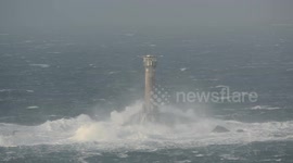 Wind and waves hit Longships lighthouse at Lands End