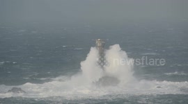 As snow blankets much of UK, huge waves batter Cornwall