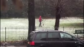 Woman walks fake dog in snow part 1