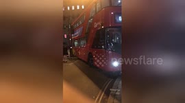 Newsflare Edit - London bus gets stuck on centre verge having taken the corner too sharply