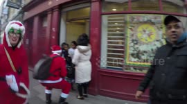 Santacon 2017: A Kindly Santa Hands Out Gifts To Local Children In Brick Lane