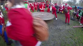Santacon 2017: Santa's Get Spun On A Playground In Tower Hill