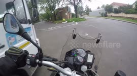 Motorbiker almost hits a truck
