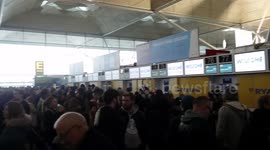 Massive amount of people waiting in line for Ryan Air custom service at Stansted Airport after numerous flight has been cancelled