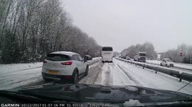 Dash-cam captures cars driving wrong way down dual carriageway in snow