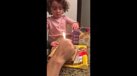 Jax practing to blow out his candles