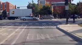 Cyclist sent spinning over car after running red light