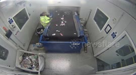 Watch the terrifying moment a flare explodes in a waste worker's hands after being left in a recycling bin