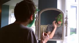 Watch this stop-motion footage of a Grinch impressionist painstakingly applying his prosthetic mask
