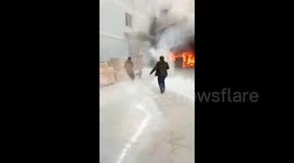 Worker cheats death after walking into ablaze factory to retrieve phone