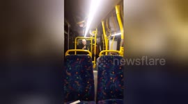 Bus passengers cheer up with elderly man impromptu performance