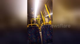 Bus passengers cheer up with elderly man impromptu performance