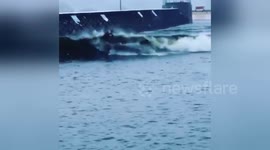 Santa goes surfing in Wales during snowfall
