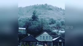 Newsflare Edit - Santa goes surfing  in Wales during snowfall