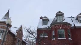 Canada geese flying south over the snowed in city of Montreal, Quebec Canada