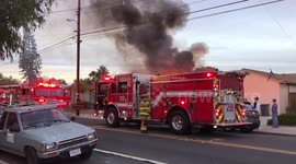 San Diego plane crash firefighters get out of truck to respond to accident