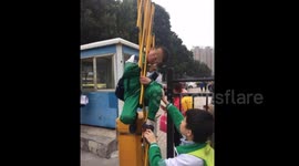 Boy gets head stuck in automatic parking barrier