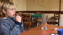 Kid Reacts to Scoring a Goal by Blowing a Piece of Paper into a Glass using a Straw