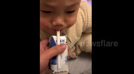 Baby enjoys 'drinking' air
